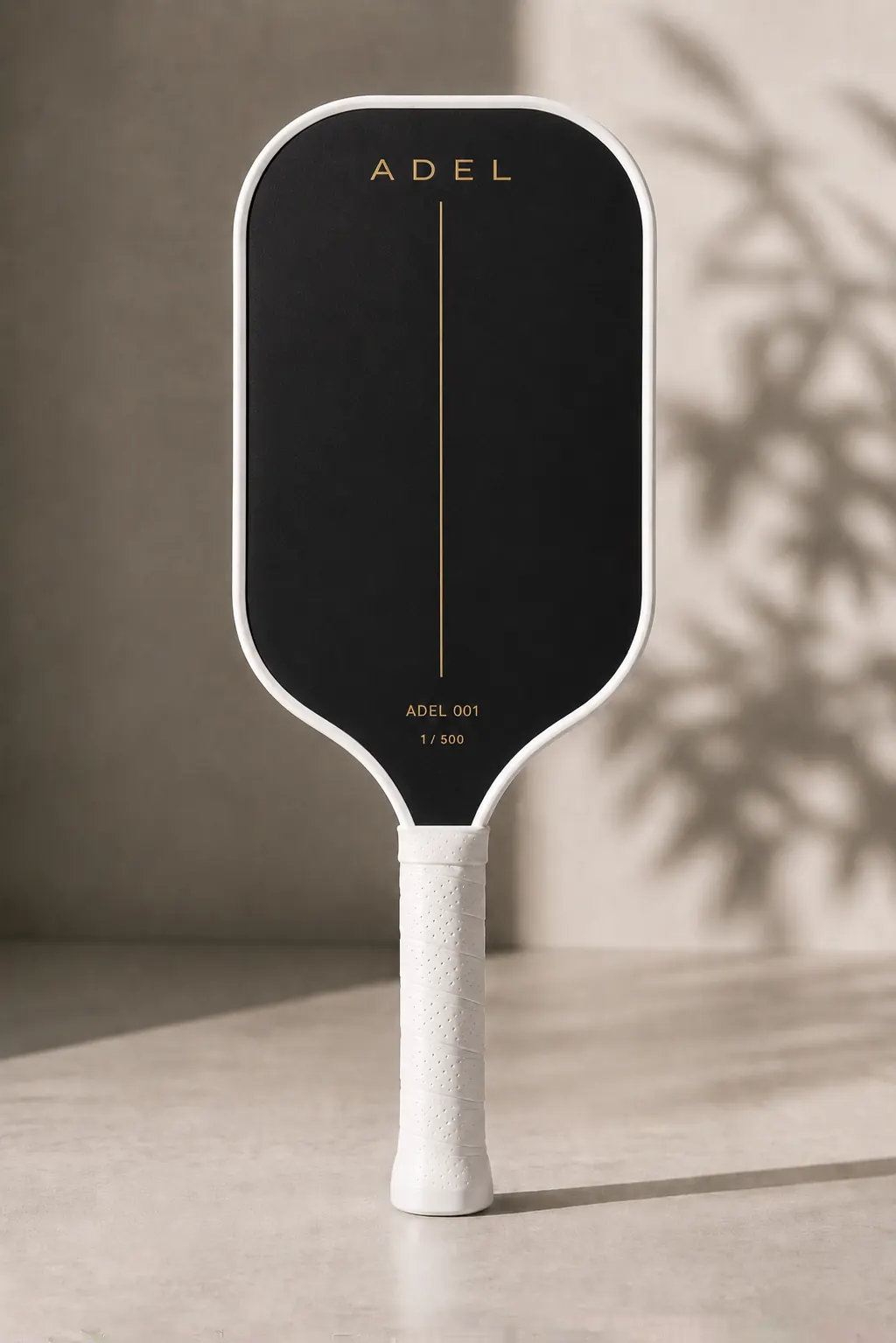 ADEL 001 — black face, white contour, gold detail
